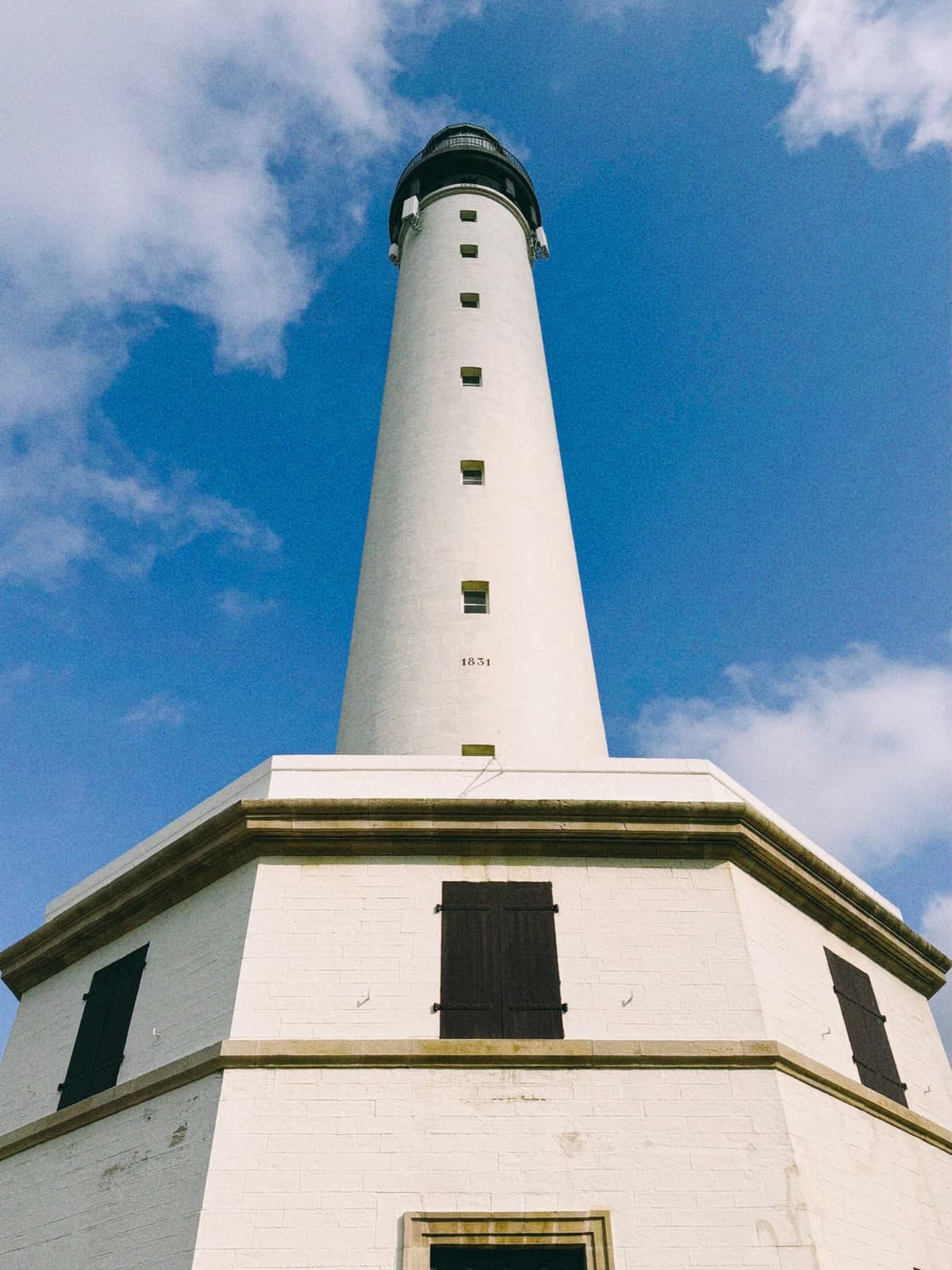 The Biarritz lighthouse, white against a scrubbed-blue sky since 1831
