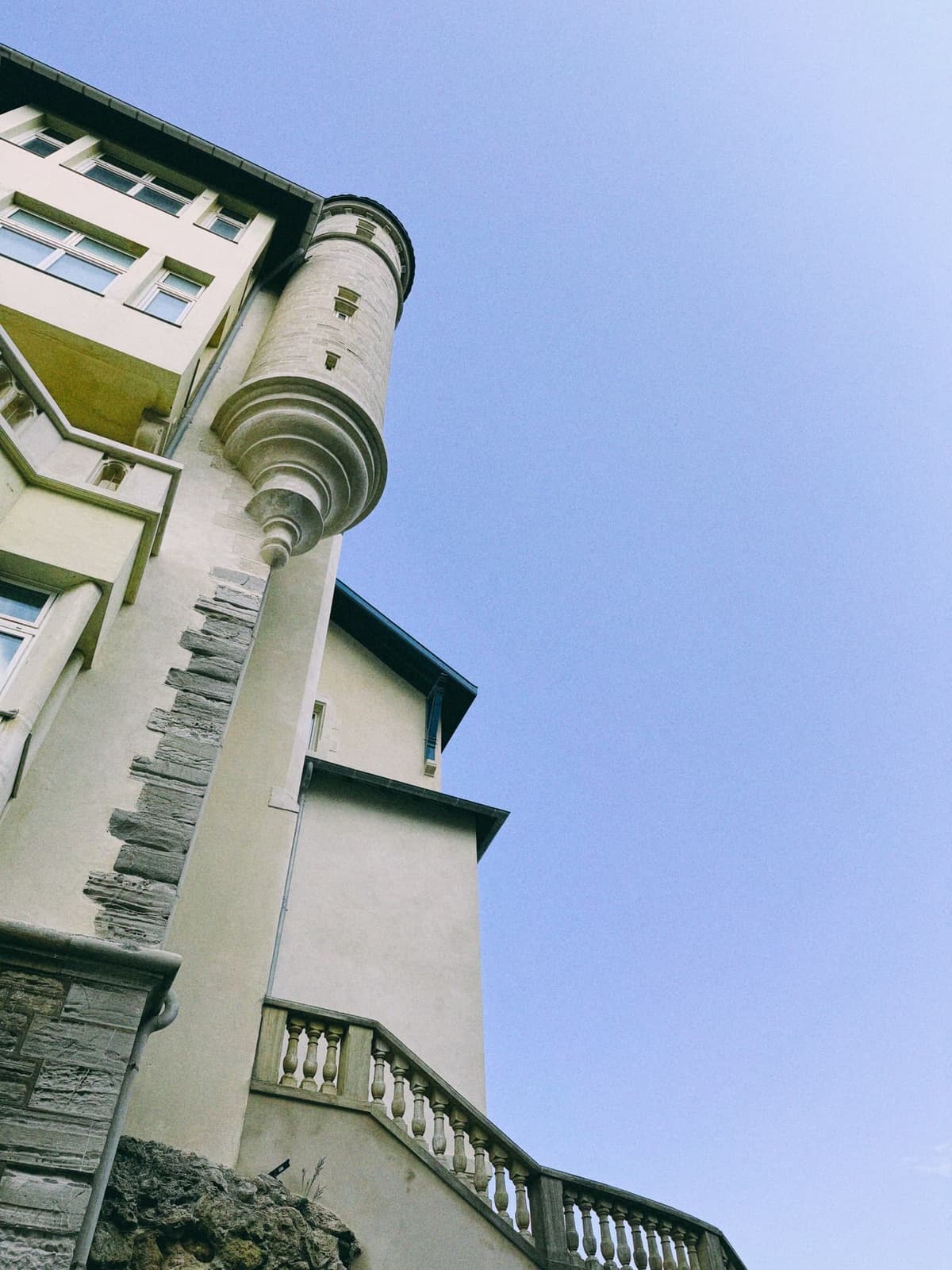 A turret hangs off the villa like an afterthought from another century